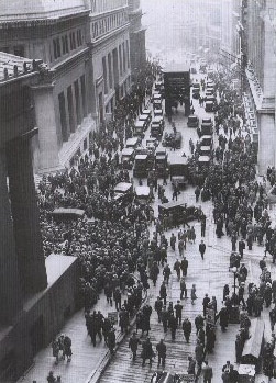 A crowd gathers at the intersection of  Wall and Broad streets after the 1929 crash.  The New York Stock Exchange (18 Broad Street) is on the right.  The majority of people are congregating in Wall Street on the left between the "House of Morgan" (23 Wall Street) and Federal Hall (26 Wall Street).